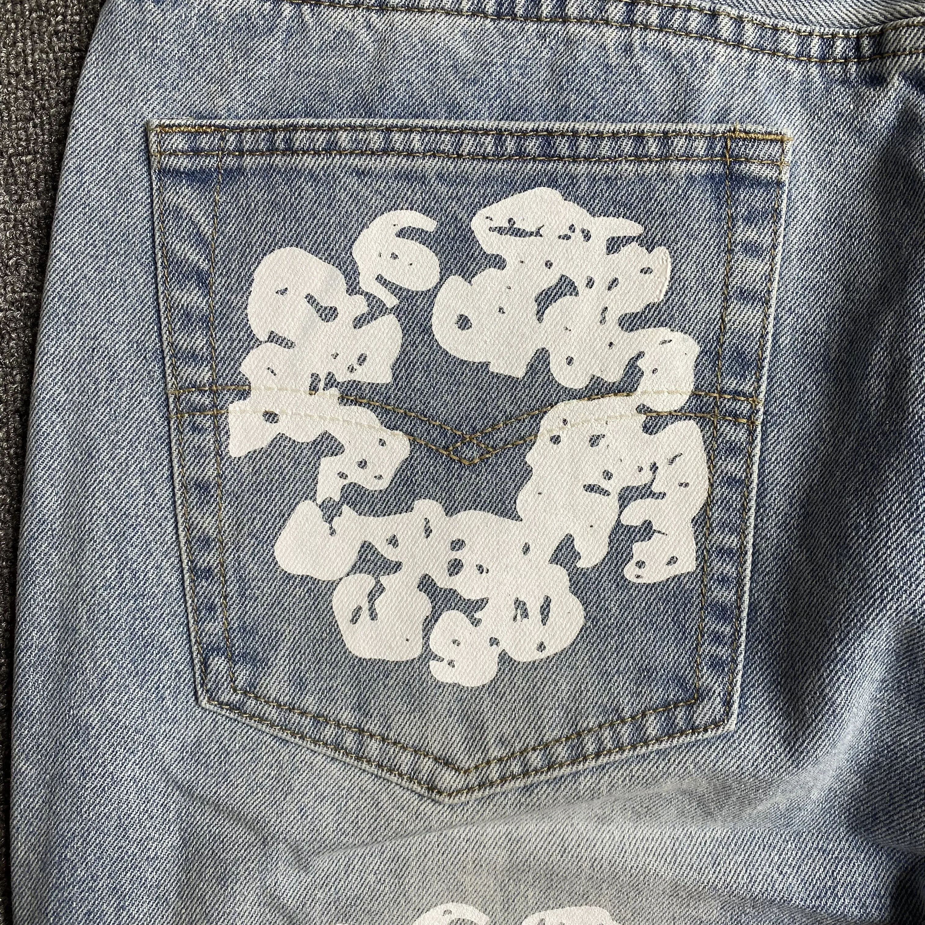 DENIM TEARS x LEVI'S COTTON WREATH JEANS LIGHT WASH