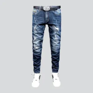 Grunge dark men's wash jeans