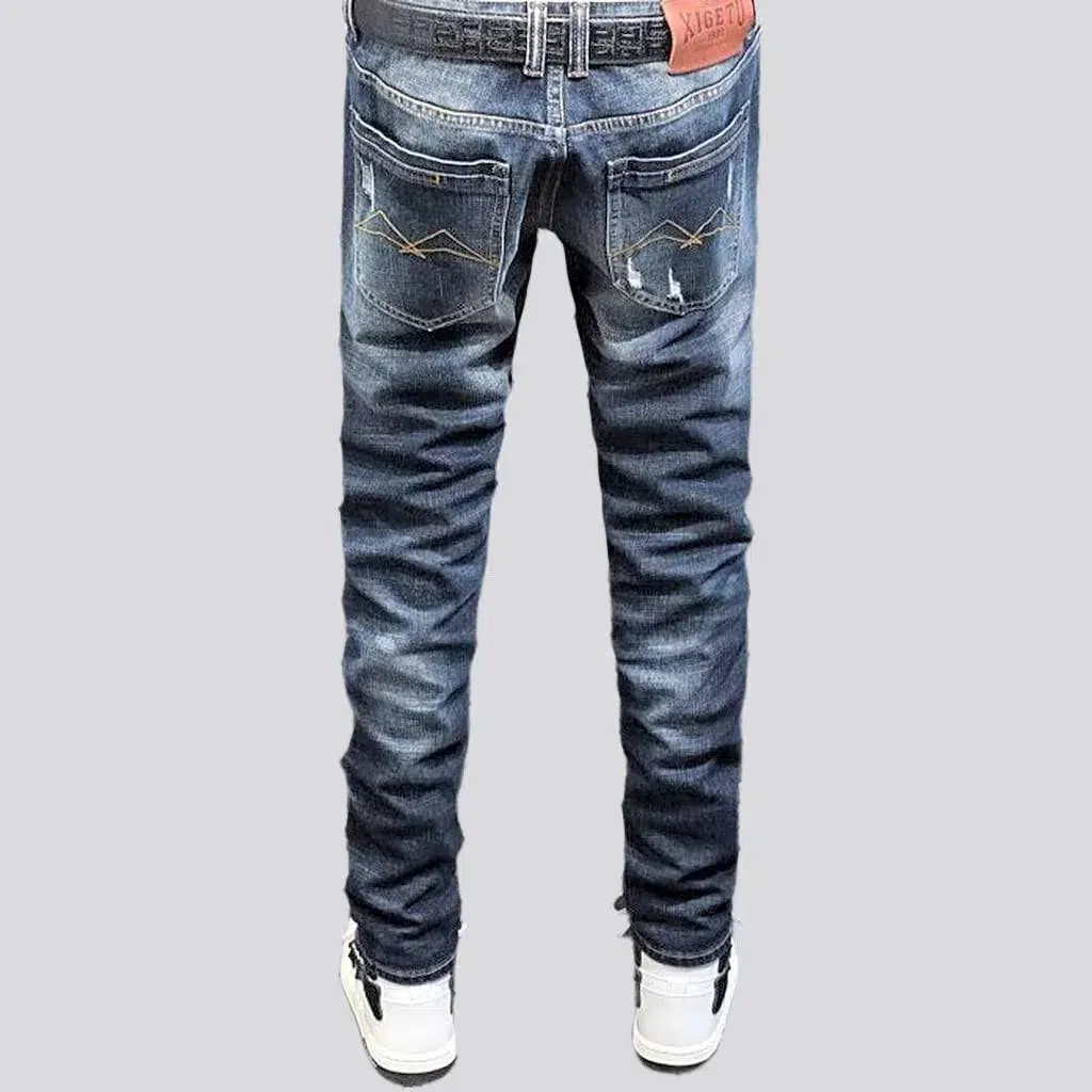 Grunge dark men's wash jeans