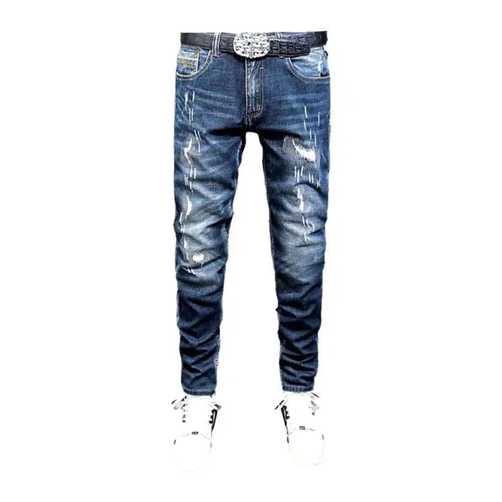 Grunge dark men's wash jeans